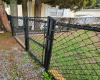 When the yard was completely redone, the owner installed chain link fencing to create a completely safe space for his 2 small dogs.