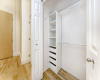 This well designed closet offers plenty of space for clothes, shoes and more.