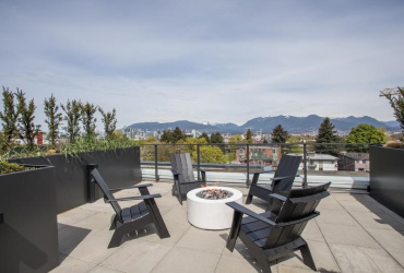 Common Roof Top Deck with views, kitchen, long dining table with twinkle lighs & fire pit. Great spot to hang out!