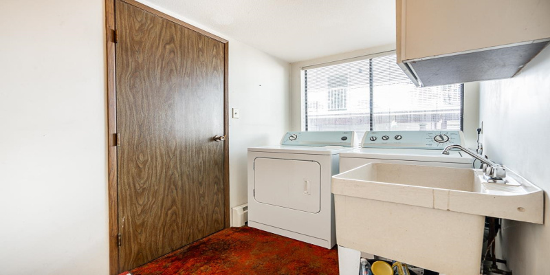 Large Laundry Room with access to double car garage.