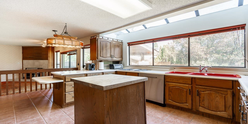 This is a Chef's size kitchen with built-in pantry, appliances, lots of preparation space and loads of cabinets for storage. Massive windows & open skylight windows allowing in lots of natural light; huge, deep, farm house size double sinks.