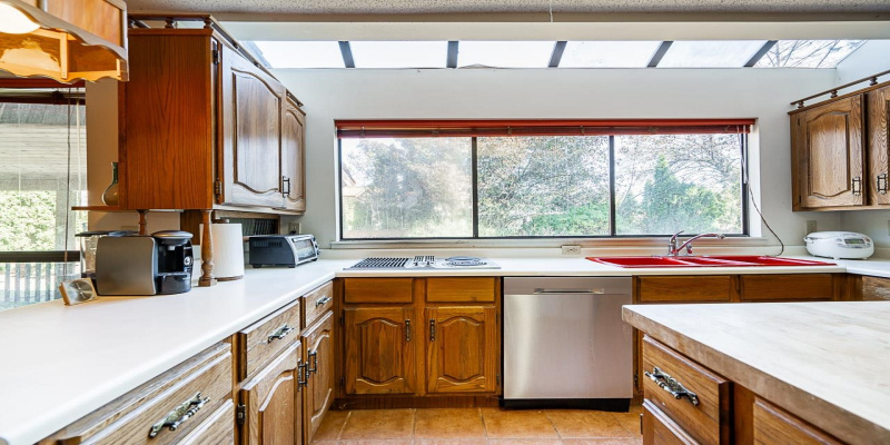 This is a Chef's size kitchen with built-in pantry, appliances, lots of preparation area and loads of cabinets for storage. Massive windows & open skylight windows allowing in lots of natural light; huge, deep, farm house size double sinks.